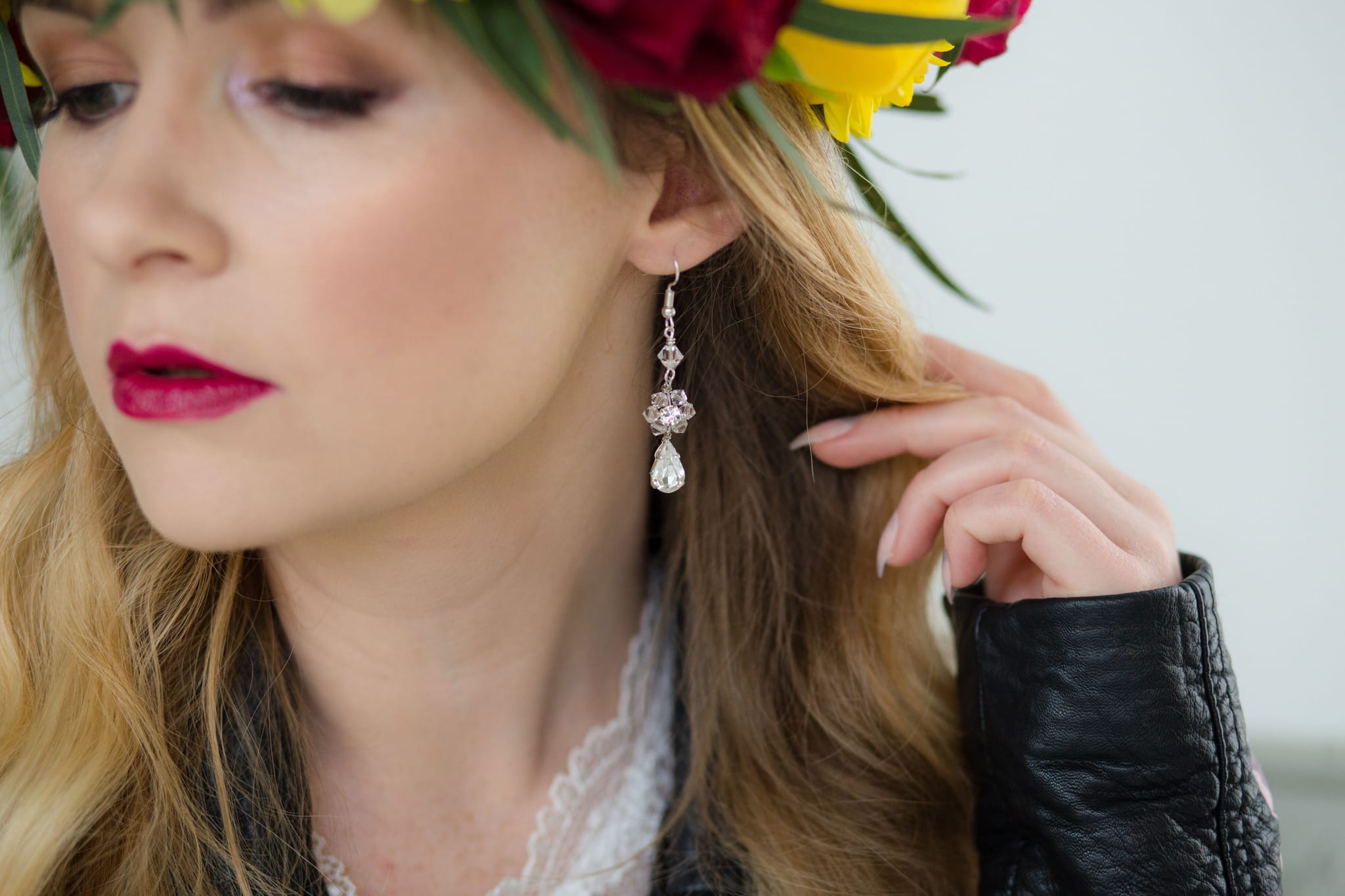 Boho Bride wearing flower crown and leather jacket and bridal jumpsuit