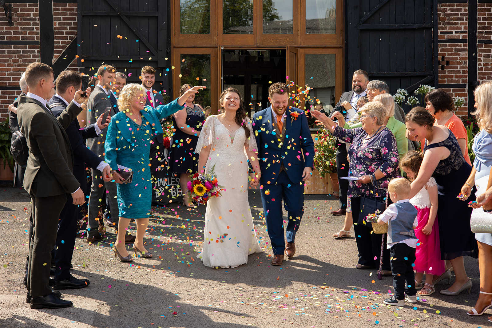 Hundred house wedding with bright confetti