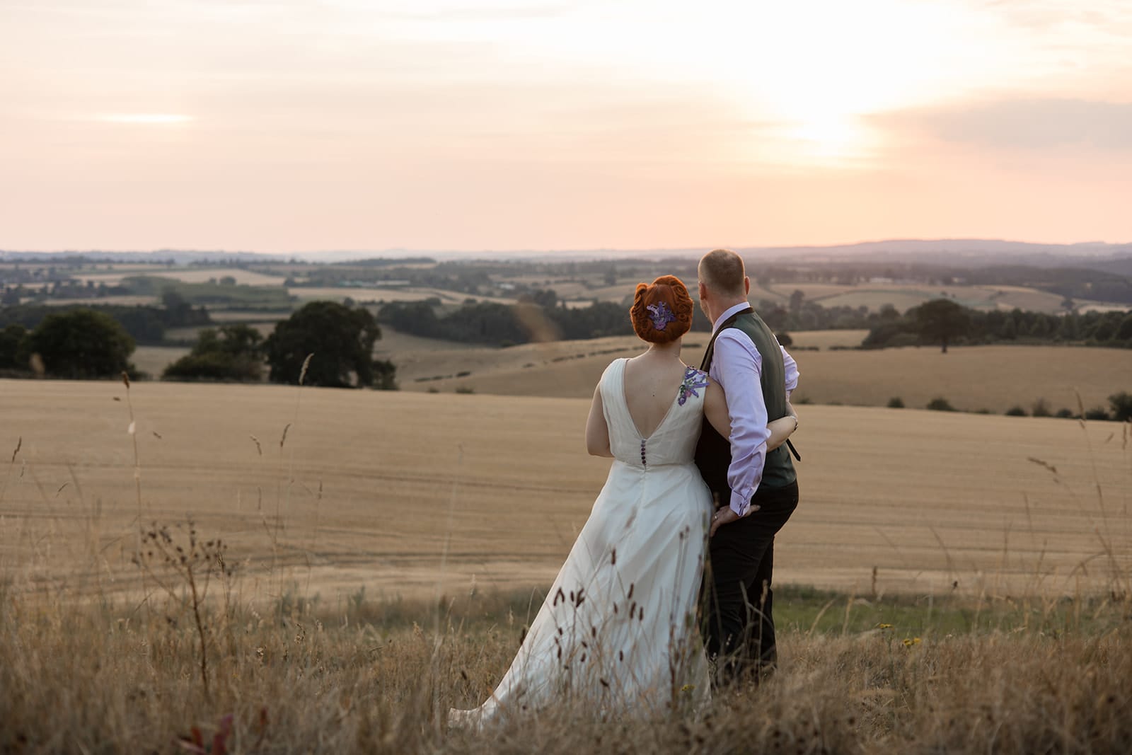 High Grosvenor House Wedding photo at sunset with couple looking out at the view