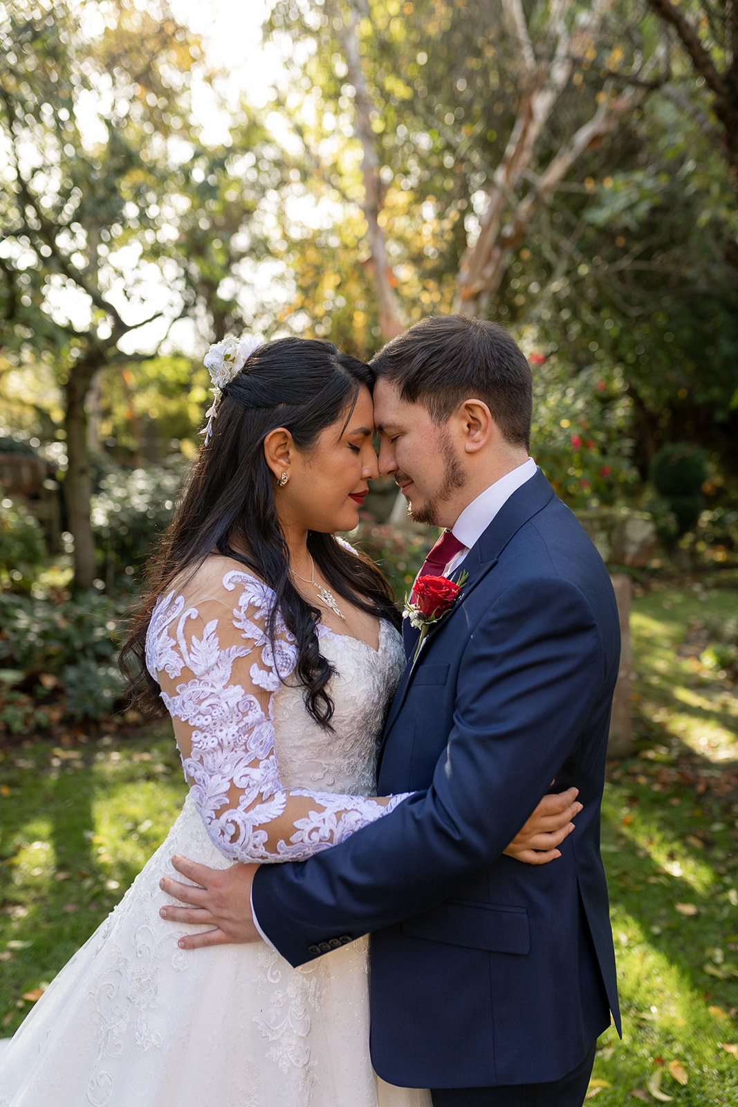 Hundred house wedding garden with couple in wedding outfits