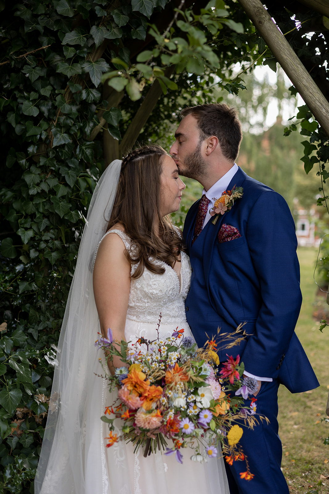 Wedding day portrait of a couple in an archway