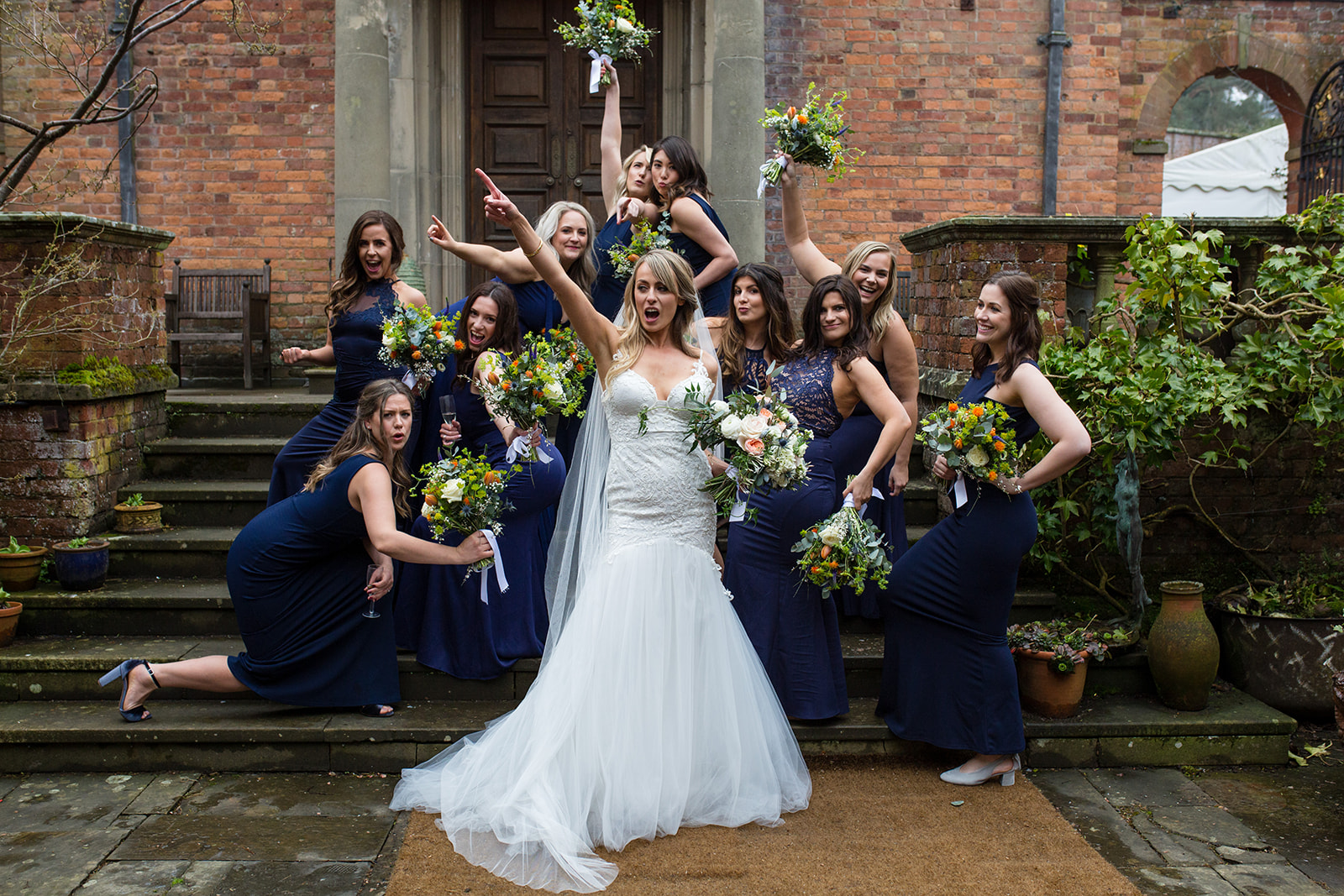 Bride and bridesmaids looking fun and happy 